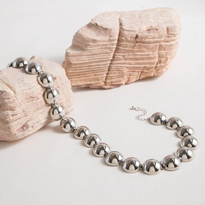 Detail of vintage silver ball choker with polished spheres and adjustable lobster clasp
