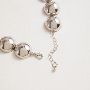 Detail of silver hemispherical mirror necklace with lobster clasp and extension chain