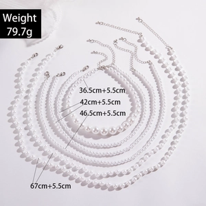 Multi-layer white faux pearl necklace set with six strands and adjustable silver clasps