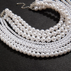 Close-up of elegant multi-layer pearl necklace with silver lobster clasp and extender