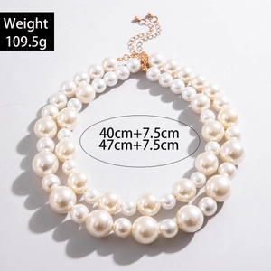 Double-layered pearl necklace with golden extender chain weighing 109.5g and 47cm length