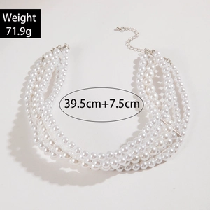 Detail of five-layer faux pearl necklace with silver lobster clasp and extension chain