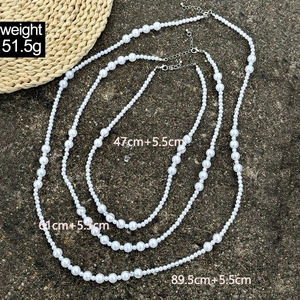 Detailed size chart for layered faux pearl necklaces with weights and lengths