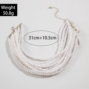 Detail showing 8-strand pearl necklace with lobster clasp and adjustable silver extension