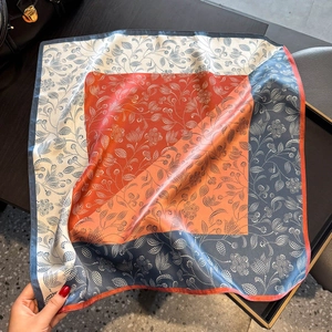 Silk-like square scarf with paisley floral print in burgundy, navy, and orange hues