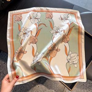 Elegant mint green silk square scarf with hand-painted floral print and satin finish