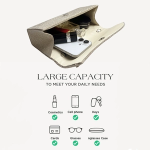 Interior view of champagne glitter clutch bag showing capacity for phone and cosmetics