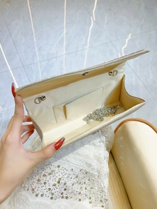 Golden glitter evening clutch bag with chain strap and satin interior for parties