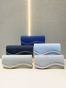 Elegant clutch bags for women with shimmer fabric and wavy rhinestone trim in five colors