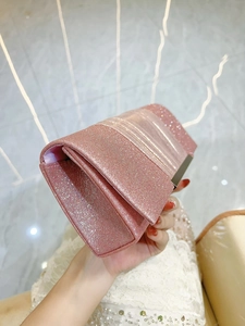 Elegant pink sequin clutch evening bag with pleated design and metal shoulder strap