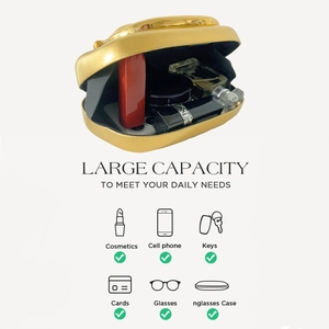 Interior view of the gold evening bag showing spacious capacity for phone and cosmetics