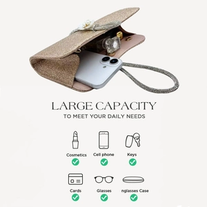 Detailed view of spacious interior of gold sequin evening bag showing daily essentials
