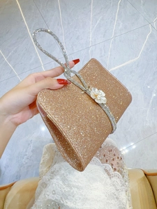 Sparkly champagne gold evening clutch bag with pearl flower and rhinestone ring handle
