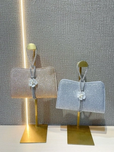 Sparkling evening clutch bag with pearl flower detail and rhinestone chain strap