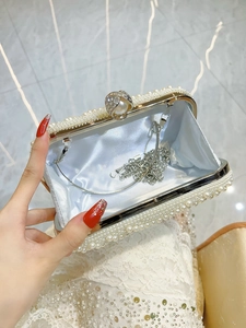 Elegant pearl evening clutch with rhinestone clasp and blue satin lining with chain