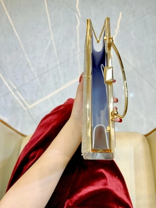 Luxury gold sequin evening clutch bag with metal handle and spacious interior