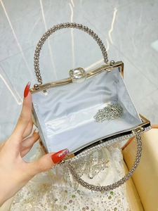 Sparkling silver rhinestone evening bag with elegant metal handle and interior chain