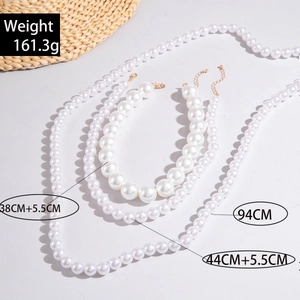 Detail view of multi-layer faux pearl necklaces set with weights and length measurements