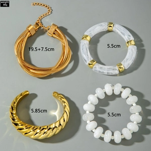 Detailed set of four gold liquid metal bangles with beads and textured resin links