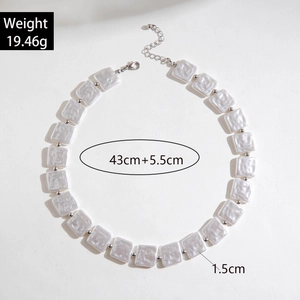 Detail of beaded necklace with 1.5cm square pearlescent resin beads and lobster clasp