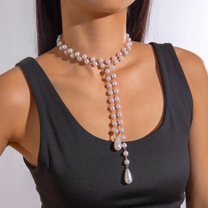 Detail of layered lavender pearl necklace with long tassels and teardrop pendants