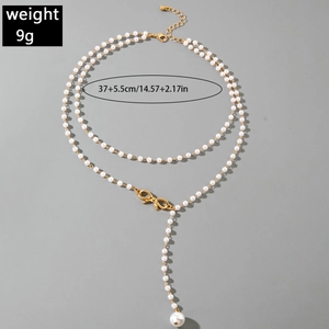 Detailed size and weight chart for a double-layer pearl necklace with golden bow pendant