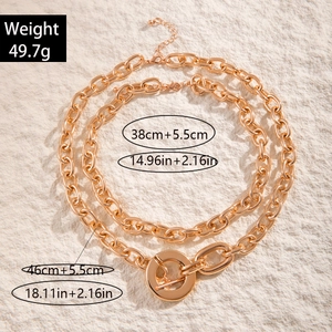 Detail of layered gold chunky chain necklace with toggle clasp and size measurements
