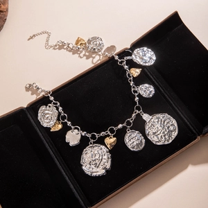 Detailed close-up of retro acrylic beaded necklace with alloy flower and heart pendants