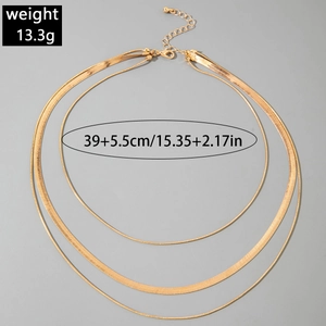 Detail view of layered gold chain necklace set with weight and size specifications