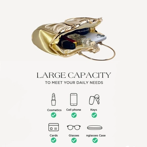 Macro view of gold satin evening bag showing large capacity for phone and cosmetics