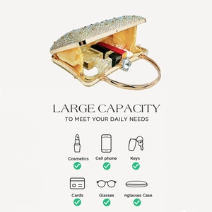 Detail view of gold rhinestone evening clutch showing large crystal ring handle and interior space