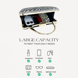 Internal view of the gold rhinestone evening clutch showing capacity for phone and makeup