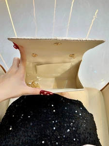 Beige pleated evening clutch with detachable gold chain strap and inner pocket