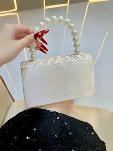 Elegant champagne satin pleated evening clutch bag with luxury pearl handle for weddings
