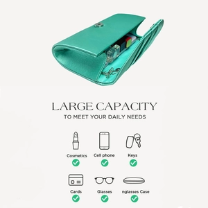 Detail of tiffany blue evening clutch bag showing large capacity for essentials