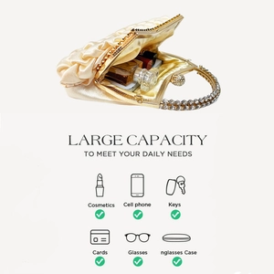 Internal view of satin evening bag showing space for phone and makeup essentials
