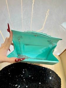 Chic pleated mint satin evening clutch bag with elegant silver chain strap for women