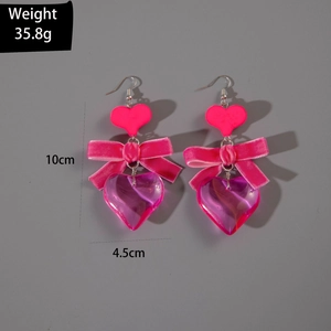 Detail view of pink bow heart earrings showing 10cm length and 35.8g weight specs