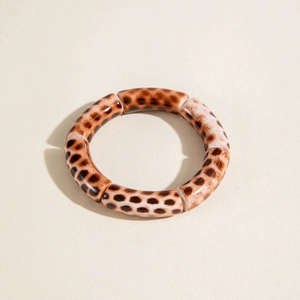 Retro leopard print elastic tube bracelet with acrylic segments for a boho chic style