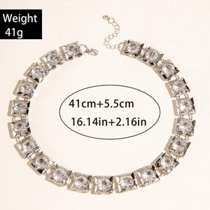 Detail view of double-layer metal chain necklace with square links and clear crystals