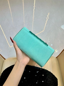Mint green pleated satin clutch bag with metal chain strap for formal evening events