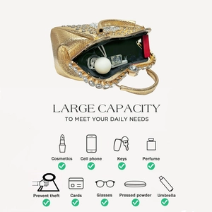 Detail view of large capacity gold evening bag interior showing storage space for essentials