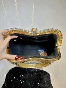 Luxury gold evening handbag with crystal accents and detachable metal chain strap