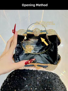 Detailed view of luxury rhinestone clutch interior with golden chain and clasp guide
