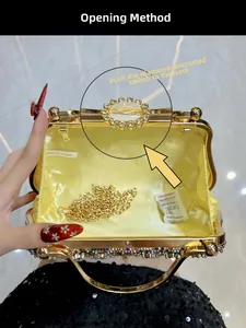Detail view of gold evening bag with rhinestone exterior and satin lining and chain