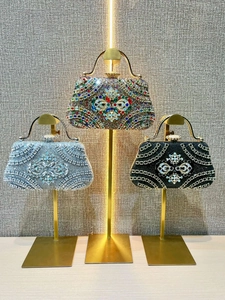Luxury rhinestone evening clutch bags in multi-color, silver, and black with metal handles