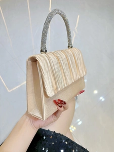 Elegant champagne pleated satin evening clutch with sparkling rhinestone handle for weddings