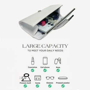 Interior capacity detail of white evening clutch bag showing storage for phone and makeup