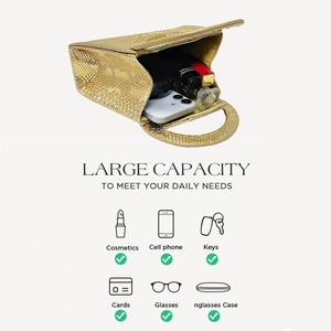 Detailed view of large capacity gold snakeskin handbag showing interior storage space