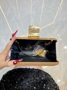 Sparkling gold glitter evening clutch bag with metal handle and detachable chain strap